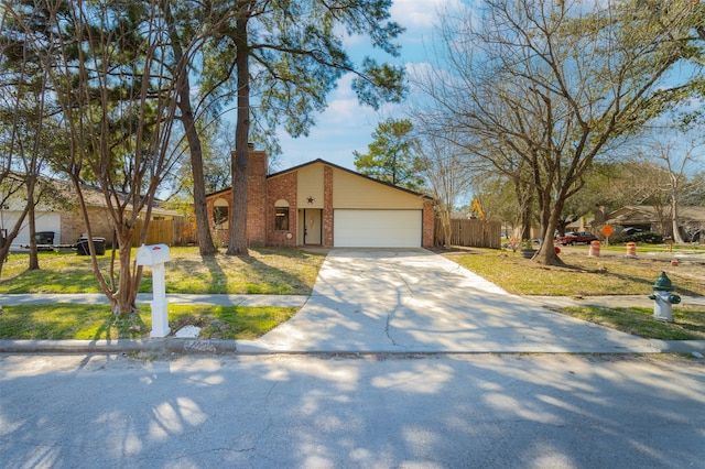 view of front of home with a garage and a front yard