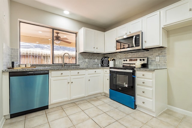 kitchen featuring white cabinetry, tasteful backsplash, ceiling fan, and stainless steel appliances