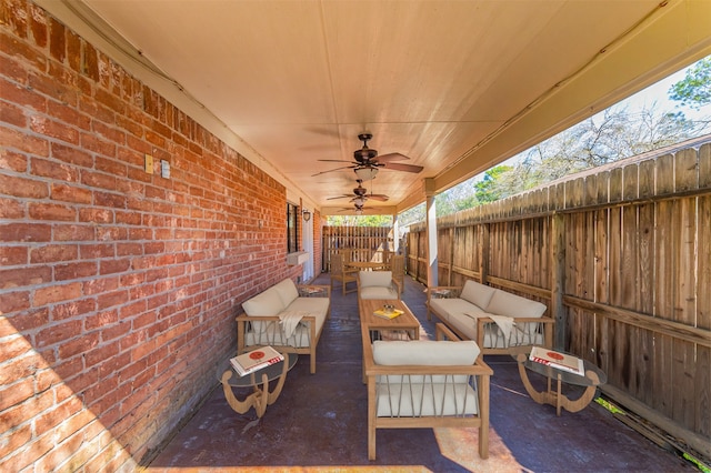 view of patio featuring an outdoor living space and ceiling fan