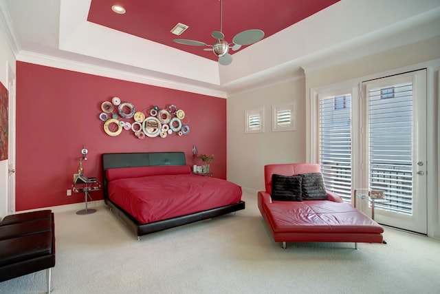 carpeted bedroom with access to outside, french doors, crown molding, a tray ceiling, and ceiling fan