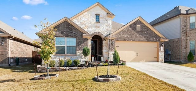 view of front of house with a garage and a front yard