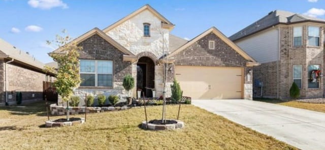 view of front of home with a garage and a front yard