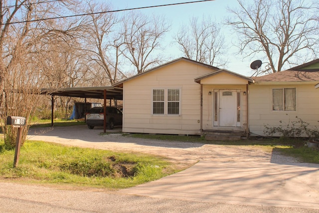 view of front of property with a carport