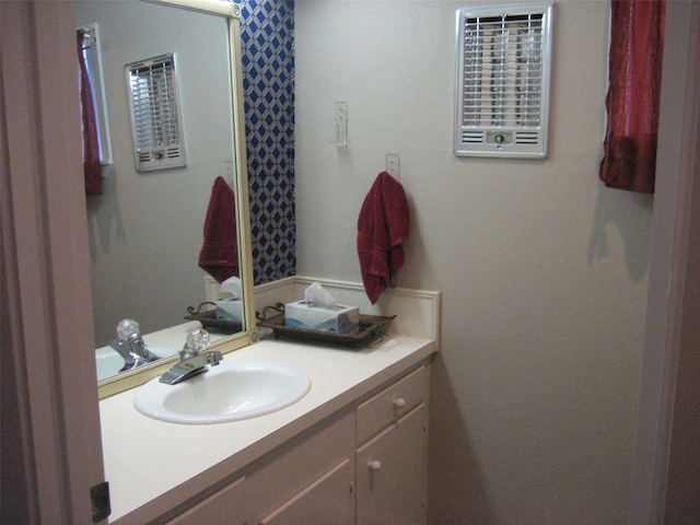 bathroom with vanity with extensive cabinet space