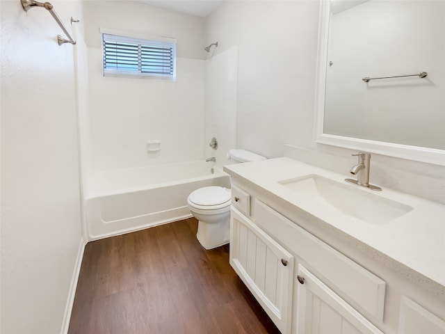 full bathroom with toilet, vanity,  shower combination, and hardwood / wood-style flooring