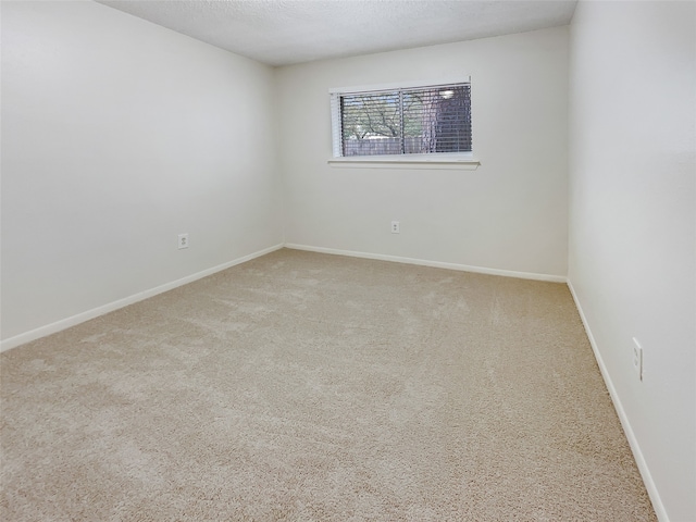 unfurnished room with carpet flooring