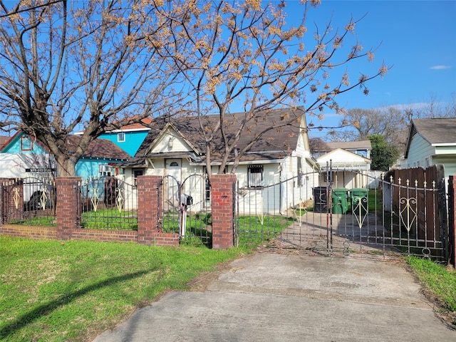 bungalow-style house with a front yard