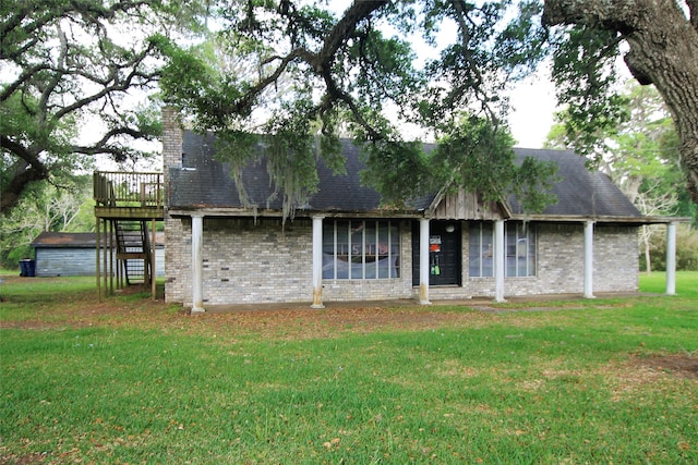 exterior space with a wooden deck and a yard