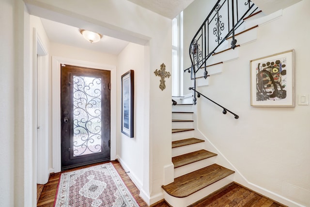 foyer with hardwood / wood-style flooring