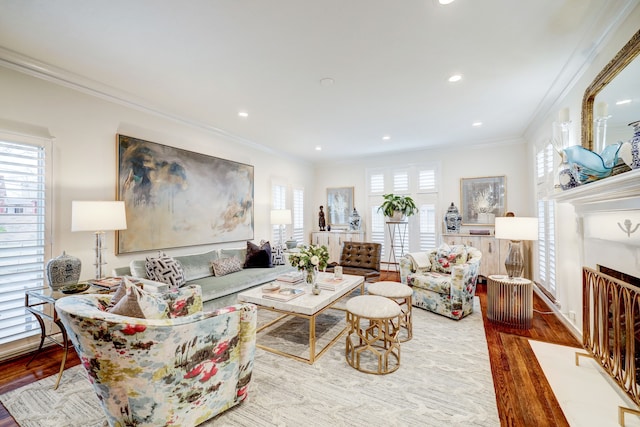 living room with hardwood / wood-style flooring and ornamental molding