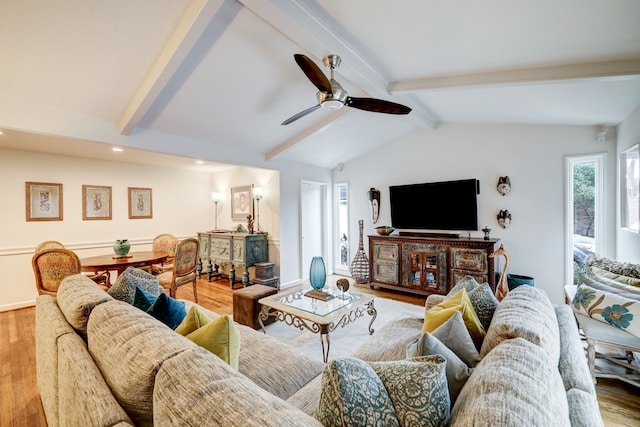 living room with vaulted ceiling with beams, hardwood / wood-style flooring, and ceiling fan