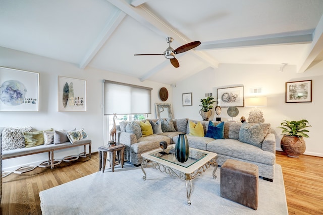 living room with hardwood / wood-style floors, vaulted ceiling with beams, and ceiling fan