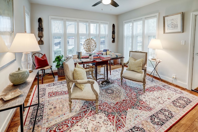 sitting room featuring light hardwood / wood-style flooring and ceiling fan