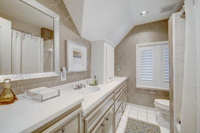 bathroom with walk in shower, vanity, tile patterned flooring, toilet, and lofted ceiling