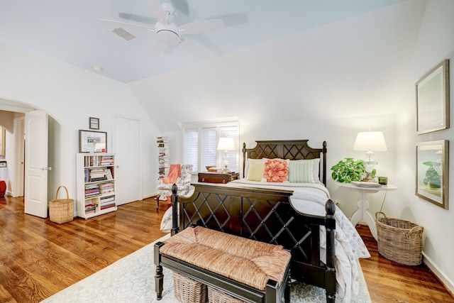 bedroom featuring ceiling fan, vaulted ceiling, and hardwood / wood-style flooring