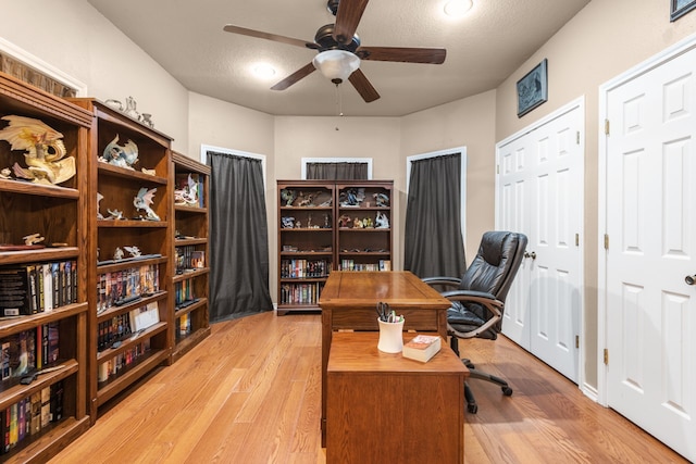 office featuring ceiling fan and light hardwood / wood-style flooring