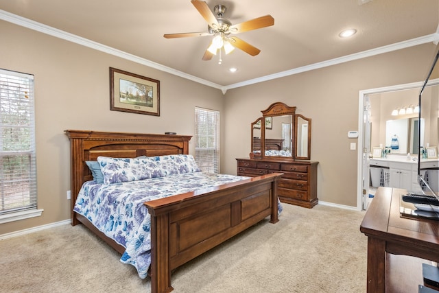 bedroom with light carpet, connected bathroom, ceiling fan, and multiple windows