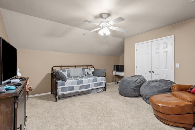 bedroom featuring light carpet, a closet, ceiling fan, and vaulted ceiling