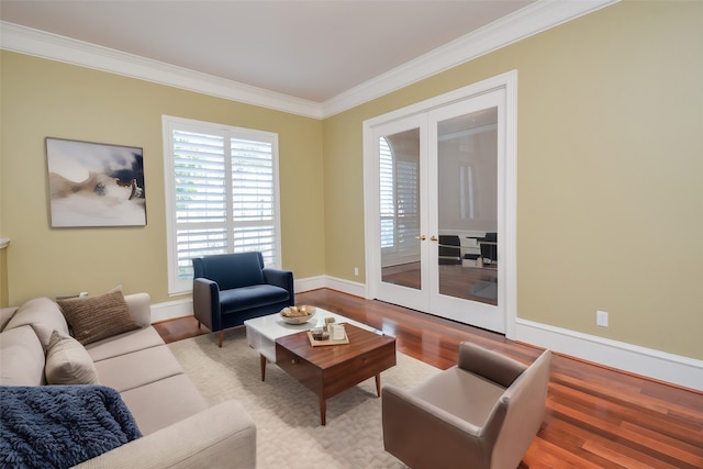 living room with ornamental molding, french doors, and hardwood / wood-style flooring