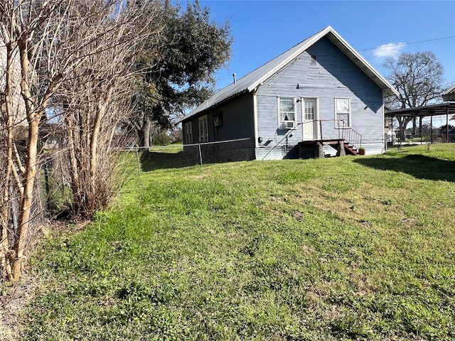 back of property featuring a lawn