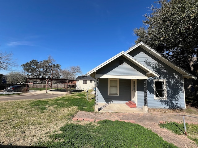 bungalow with a front yard