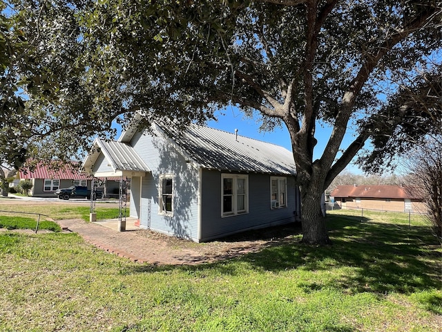 view of property exterior with a lawn