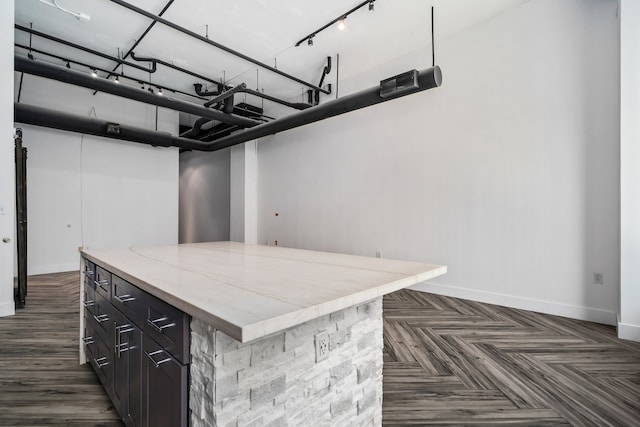 kitchen with a kitchen island and dark parquet floors