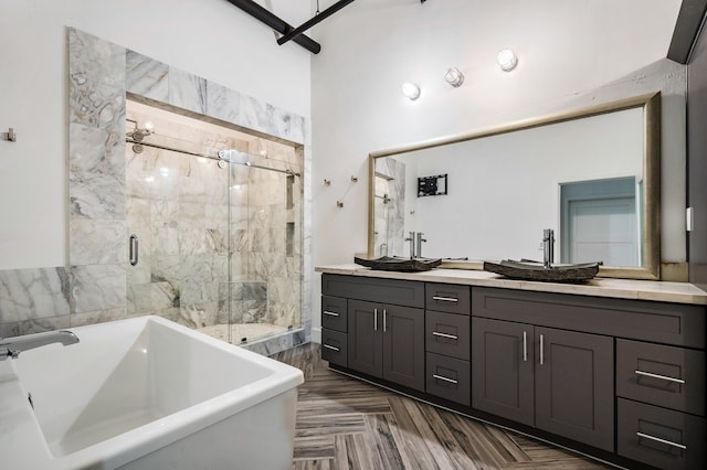 bathroom featuring double vanity, plus walk in shower, and parquet floors