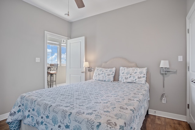 bedroom featuring ceiling fan and dark hardwood / wood-style floors