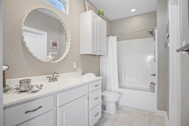 full bathroom featuring tile floors, toilet, vanity, and shower / bath combo with shower curtain