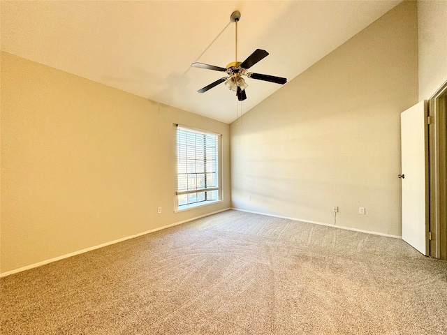 empty room featuring high vaulted ceiling, light colored carpet, and ceiling fan