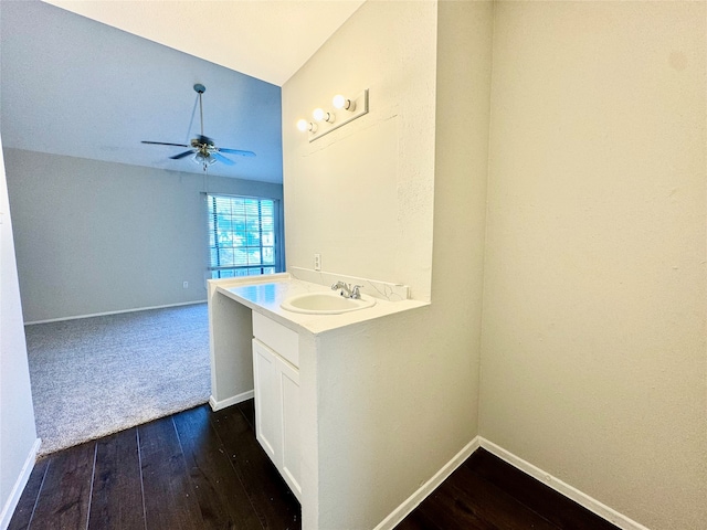 interior space featuring vanity, ceiling fan, and hardwood / wood-style flooring