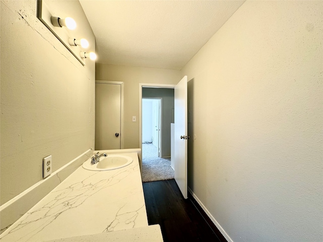 bathroom featuring vanity and hardwood / wood-style floors