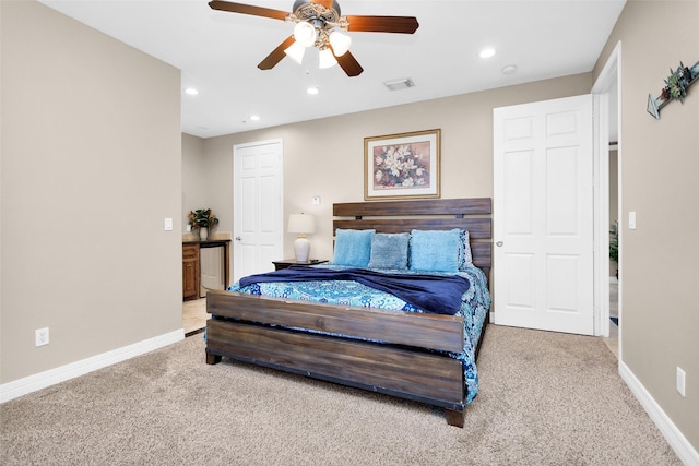 bedroom with ceiling fan and carpet