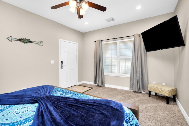 bedroom featuring light colored carpet and ceiling fan