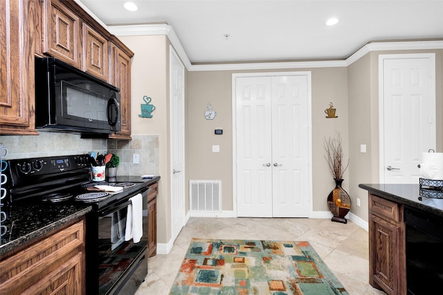 kitchen with crown molding, dark stone countertops, tasteful backsplash, and black appliances