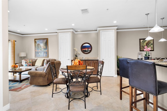 dining room featuring ornamental molding