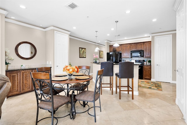 dining space featuring ornamental molding