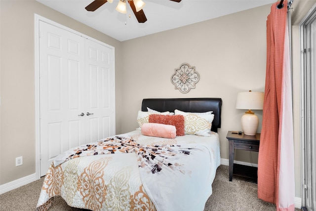 carpeted bedroom featuring ceiling fan and a closet