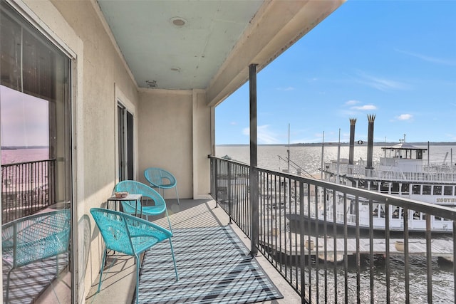 balcony featuring a water view