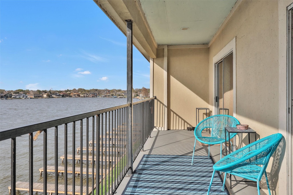 balcony featuring a water view