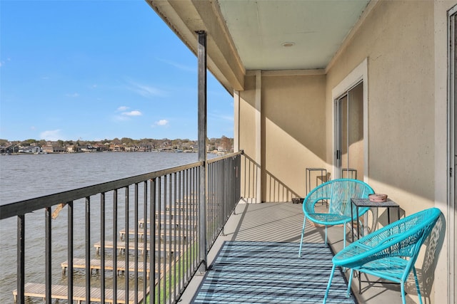 balcony featuring a water view