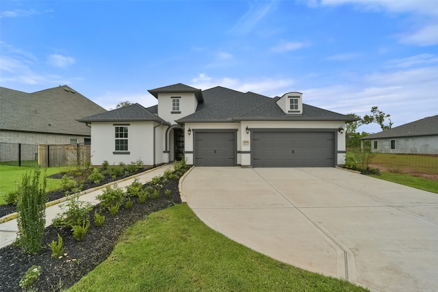 view of front facade with a garage and a front yard