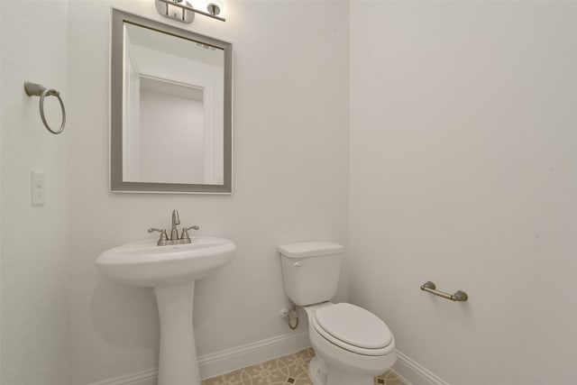 bathroom with sink and toilet