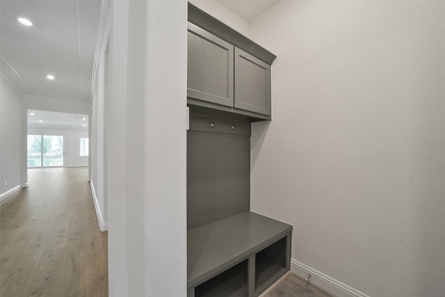 mudroom with light hardwood / wood-style floors