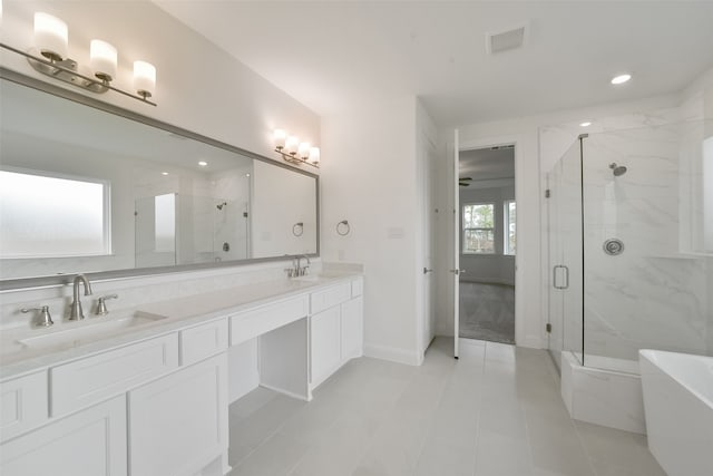 bathroom featuring tile patterned flooring, vanity, and separate shower and tub