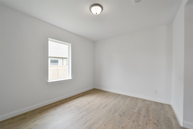 unfurnished room with light hardwood / wood-style floors