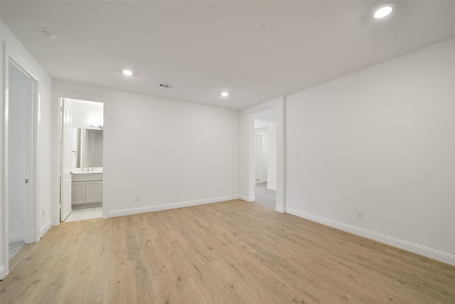 unfurnished room with light hardwood / wood-style flooring