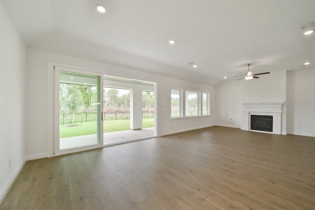 unfurnished living room featuring wood-type flooring, vaulted ceiling, and ceiling fan