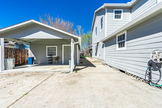 view of property exterior with a patio